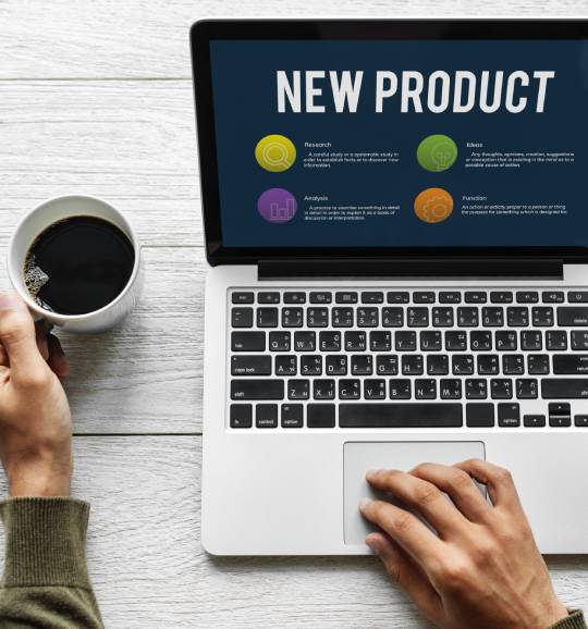 New product slide on Mac with a coffee alongside